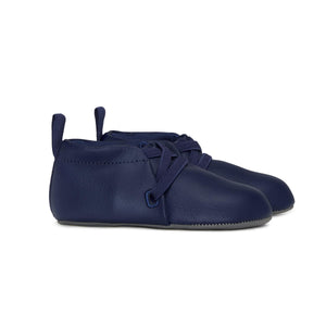 Stonz Linden Soft Sole Baby Slipper in Navy, with elastic cuff and vegan materials. Side view.