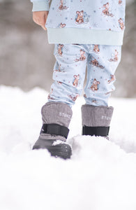 A kid in trek toddler heather grey in snow 