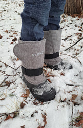 A kid in trek kid heather grey in snow 