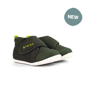 Stonz Cruiser Baby Shoe in cypress/lantern green, supportive baby shoe with flexible sole and breathable fabric. ¾ turn view