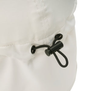 Stonz Flap Cap in Ivory, featuring an adjustable toggle for a secure fit. This lightweight, moisture-wicking sun hat offers UPF 50+ protection and full neck coverage. detail view