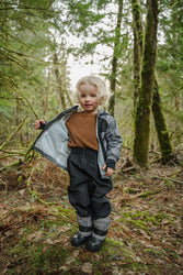 Cute Kid in Stonz Durable and waterproof  Rain Pant, Rain Jacket and Trek boots