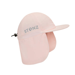 Stonz Flap Cap in Haze Pink, featuring an adjustable toggle for a secure fit. This lightweight, moisture-wicking sun hat offers UPF 50+ protection and full neck coverage. side view