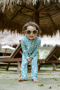 Cute kid in stonz UV protection Sunsuit