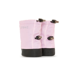 Stonz Winter Baby Booties in Haze Pink with adjustable toggles, weather resistant material and non-slip soles. ¾ turn view.