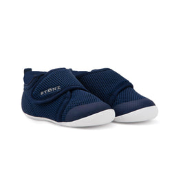 Stonz Cruiser Baby Shoe in Navy, supportive baby shoe with flexible sole and breathable fabric. ¾ turn view.