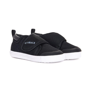 Stonz Cruiser Plus Toddler Shoe in Black. Supportive toddler runner with flexible sole and breathable fabric. ¾ turn view.