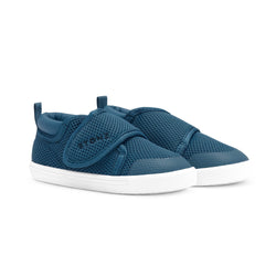 Stonz Cruiser Toddler Shoe in Denim. Supportive toddler runner with flexible sole and breathable fabric. ¾ turn view.
