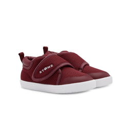 Stonz Cruiser Plus Toddler Shoe in Ruby Tonal. Supportive toddler runner with flexible sole and breathable fabric. ¾ turn view.