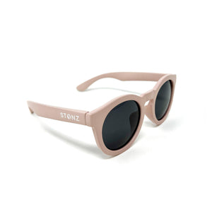 Stonz Eco Sunnies in Haze Pink with 100% UVA/UVB protection, polarized lenses, durable frames & made from 100% recycled materials. Side view.