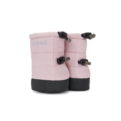 Stonz Winter Puffer Baby Booties in Haze Pink with adjustable toggles, weather resistant material and non-slip soles. ¾ turn view.