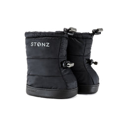 Stonz Winter Puffer Toddler Booties in Black with adjustable toggles, weather resistant material and non-slip soles. ¾ turn view.