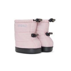 Stonz Winter Puffer Toddler Booties in Haze Pink with adjustable toggles, weather resistant material and non-slip soles. ¾ turn view.